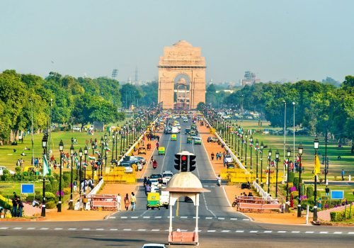 Rajpath road leading to India Gate in New Delhi with people and vehicles